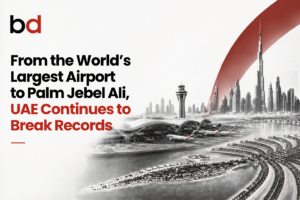 BD logo in top-left with a bold headline about UAE infrastructure and Dubai’s skyline on the right (grayscale) with a red arc, banner-style image.
